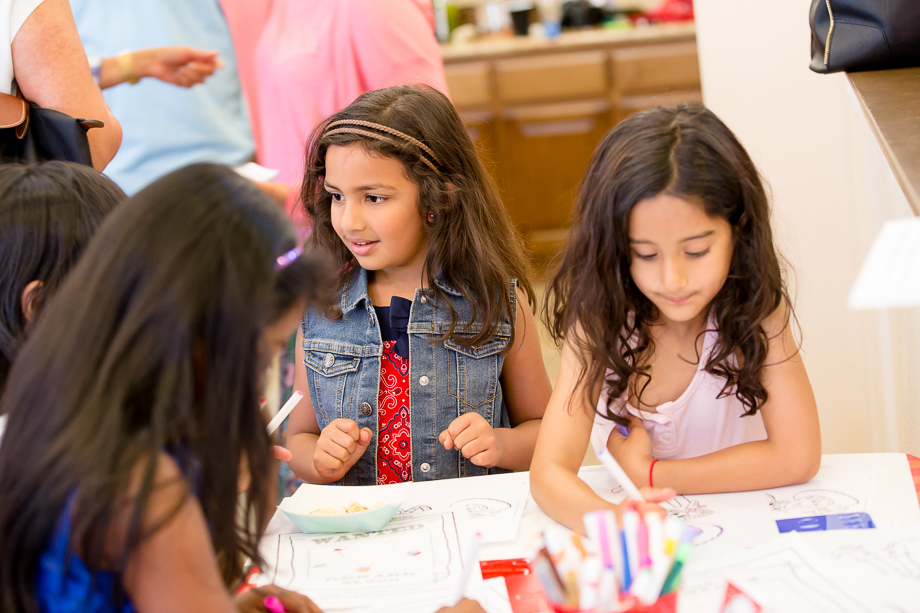 All the girls are having fun with the drawings at the birthday party