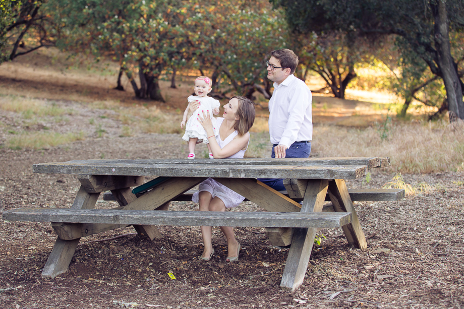Baby laughing at the camera with magical lighting at the back