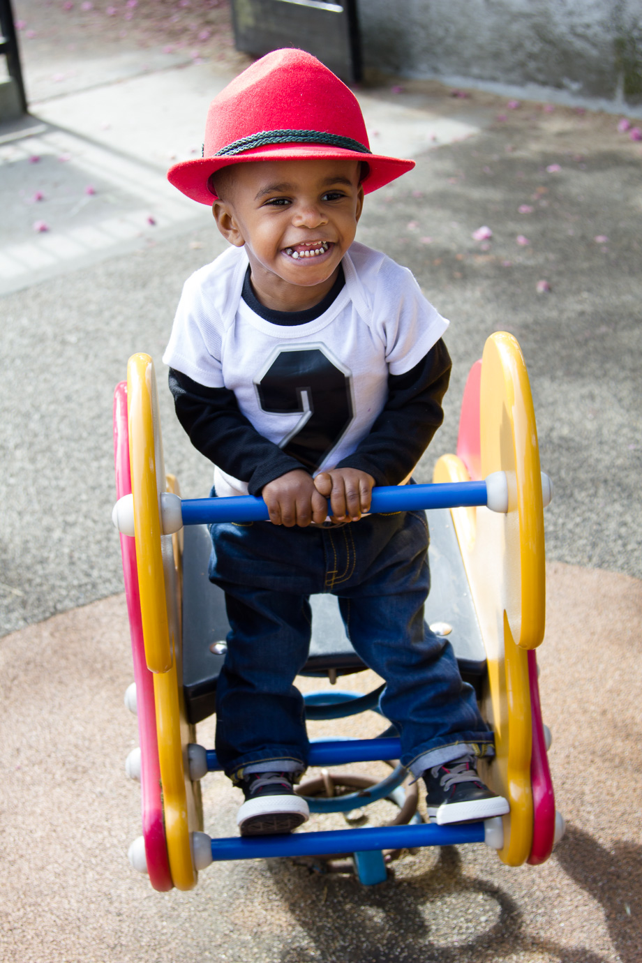 Two-year-old toddler on playground toys