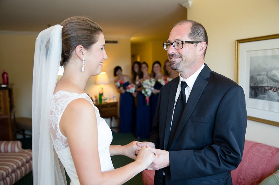 Father of the bride looking at his daughter on her wedding day