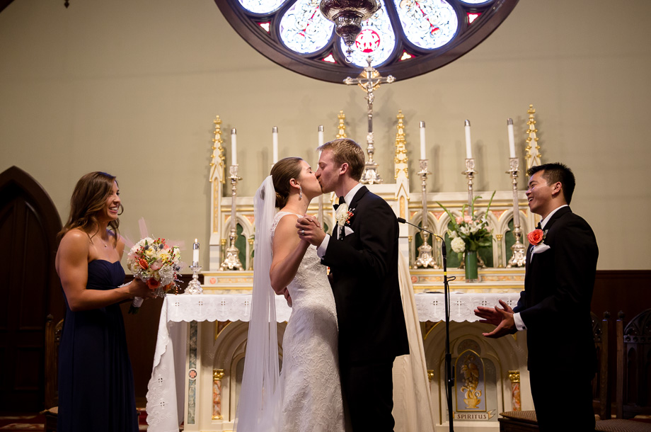 Bride and groom kissing after they are pronounced husband and wife