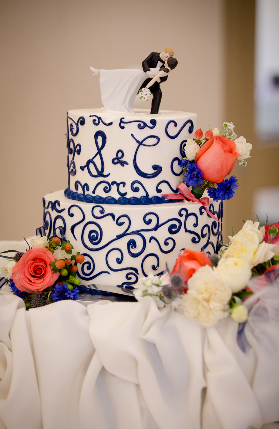 Wedding bride and groom cake topper with the couple dancing doing the dip