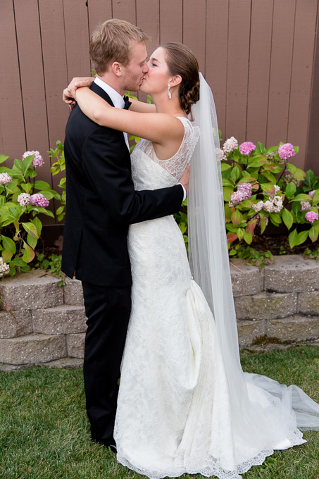 Bride and groom kissing each other