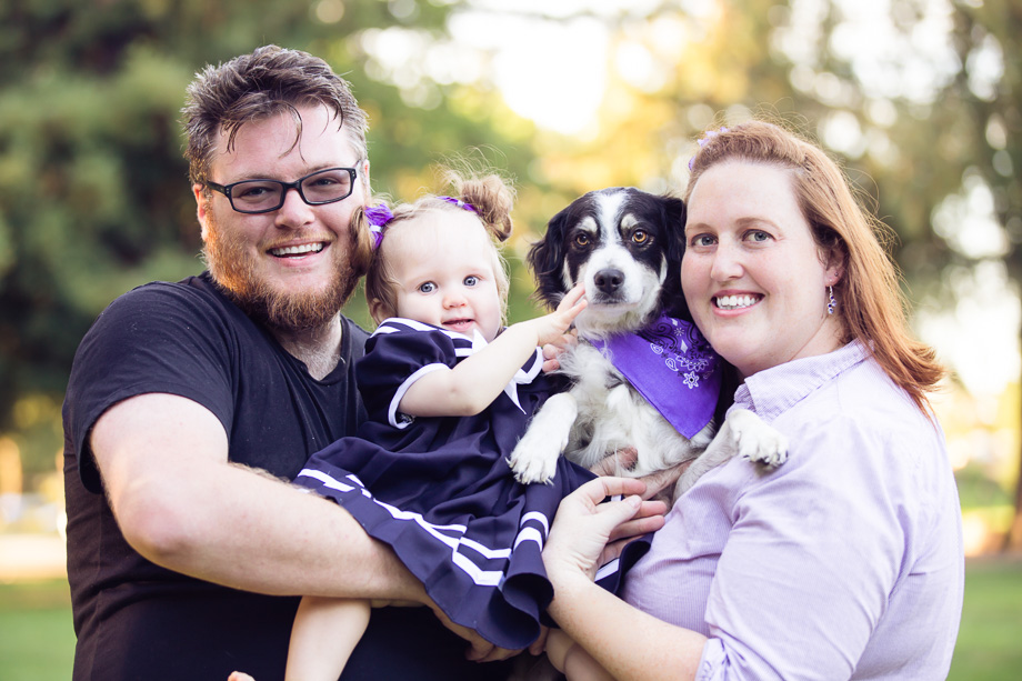 Family portrait at Cuesta Park of father, mother, daughter, and puppy