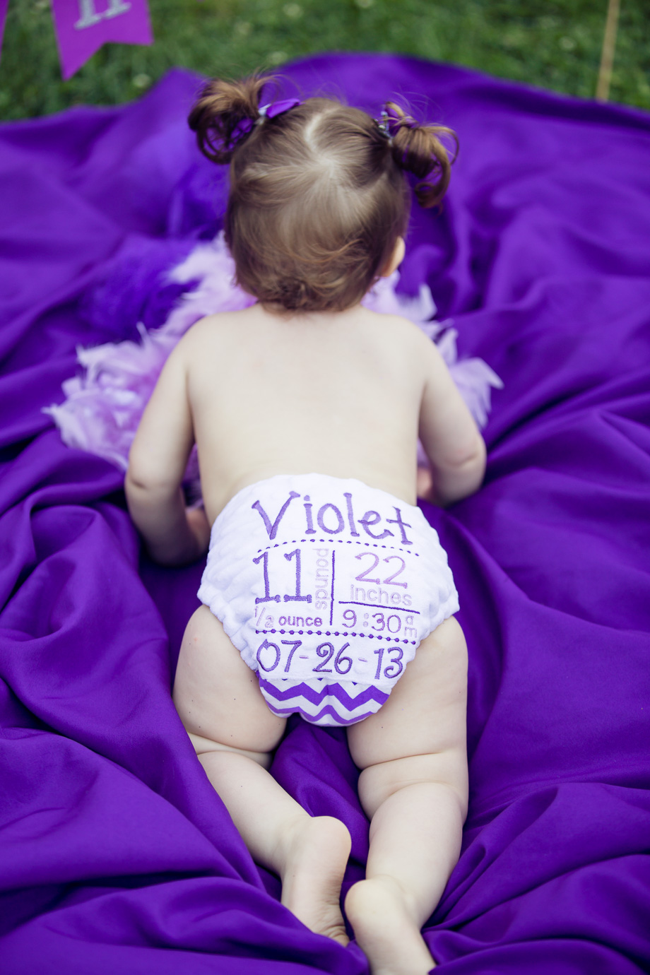 Violets cute diaper with her birthday written on it