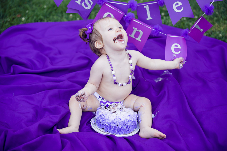 Violet the baby cant get enough of her birthday cake!