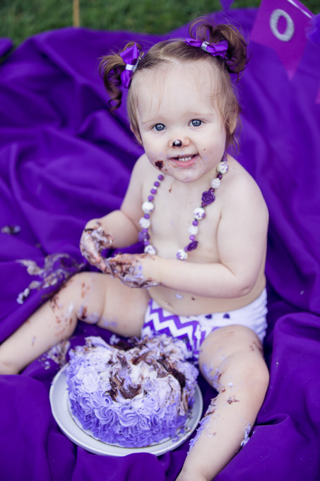 Violet has cake smeared all over her now after smashing the cake