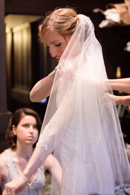 Intimate getting ready moment in the bridal suite at the Outdoor Art Club