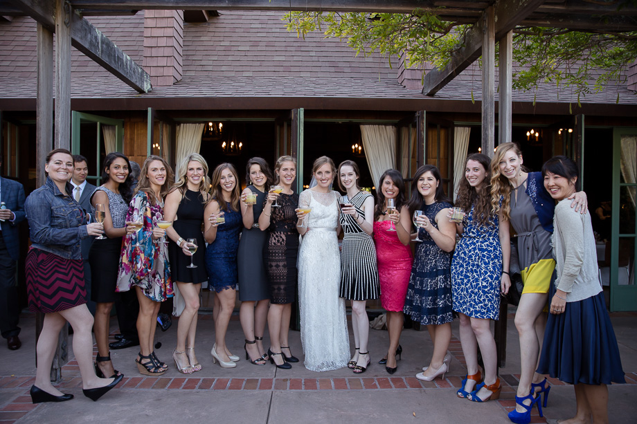 Bride cheering with the girls after the ceremony