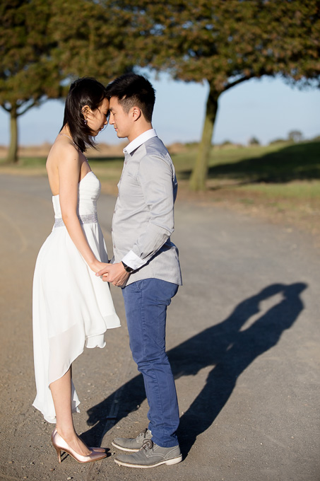 peaceful portrait of couple standing with foreheads touching