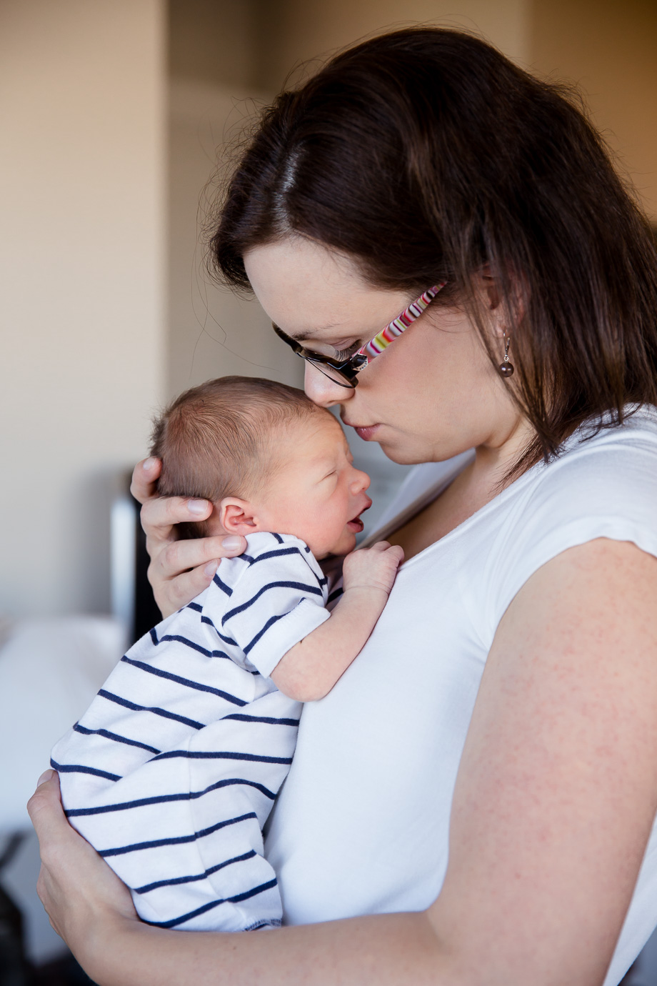 mom rubbing her nose on newborn baby forehead