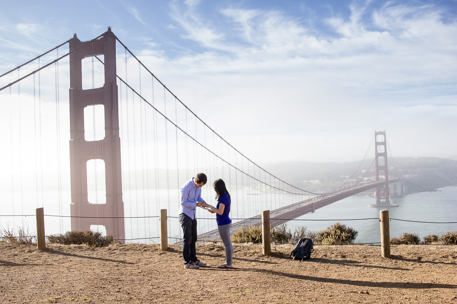 Putting on the ring for her in front of Golden Gate Bridge