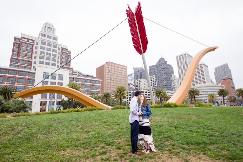 The newly engaged couple kidding in front of Cupids Span