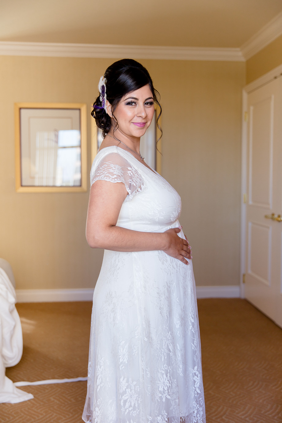 Before heading to the ceremony, the bride was getting ready at the Fairmont San Jose, the suite has gorgeous lighting. Love the purple feather hairpeice!
