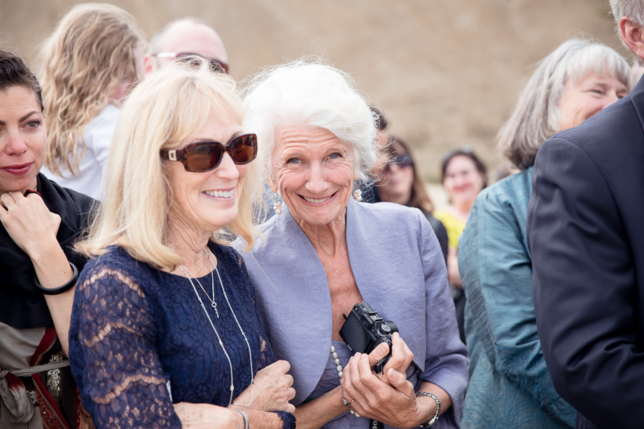 Happy family at this romantic beach ceremony