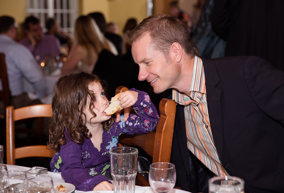 Cute little girl enjoying the reception food at the Mezzaluna Italian restaurant