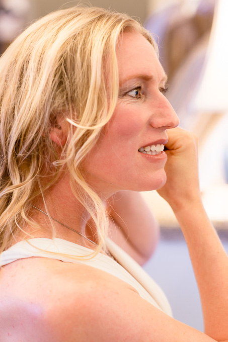 Bride looking into the mirror before leaving for the first look