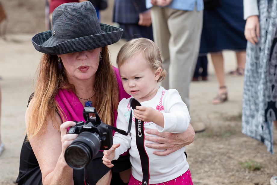 Curious little wedding guest at the beautiful beach wedding