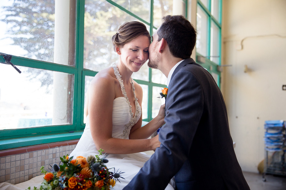 A romantic kissing shot inside an art crafting room