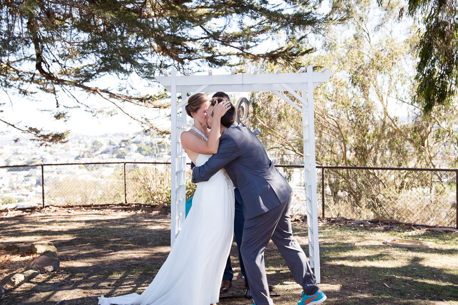 The groom cant wait another second to kiss his bride. Cutest first kiss ever for this adorable couple at their wedding ceremony