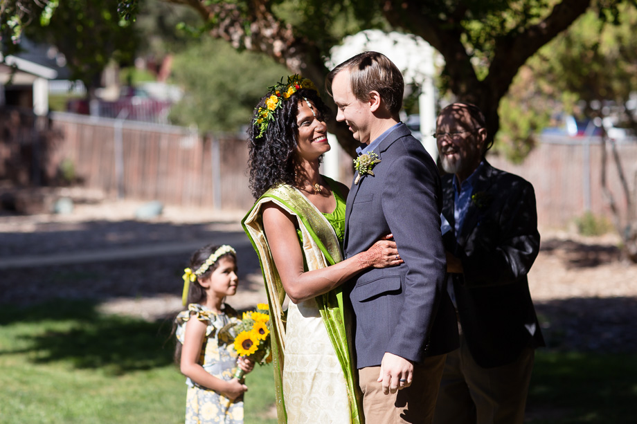 Bride and groom about to kiss at the end of the wedding ceremony