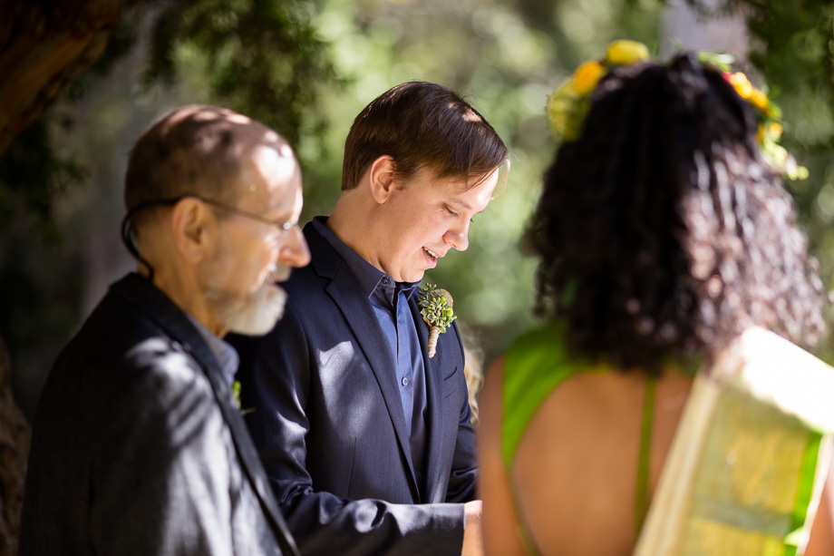 Groom reading his wedding vows