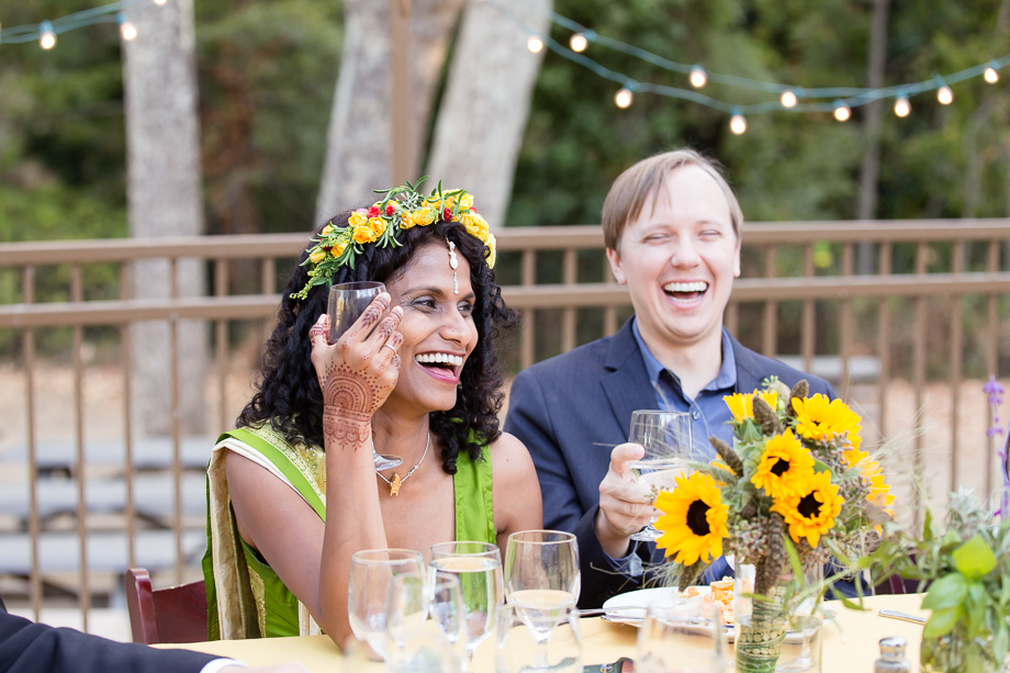 Kurt and Sumi laughing at a guests toast