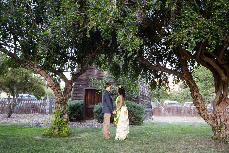 Portrait of the bride and grooming looking into each others eyes at the ceremony site