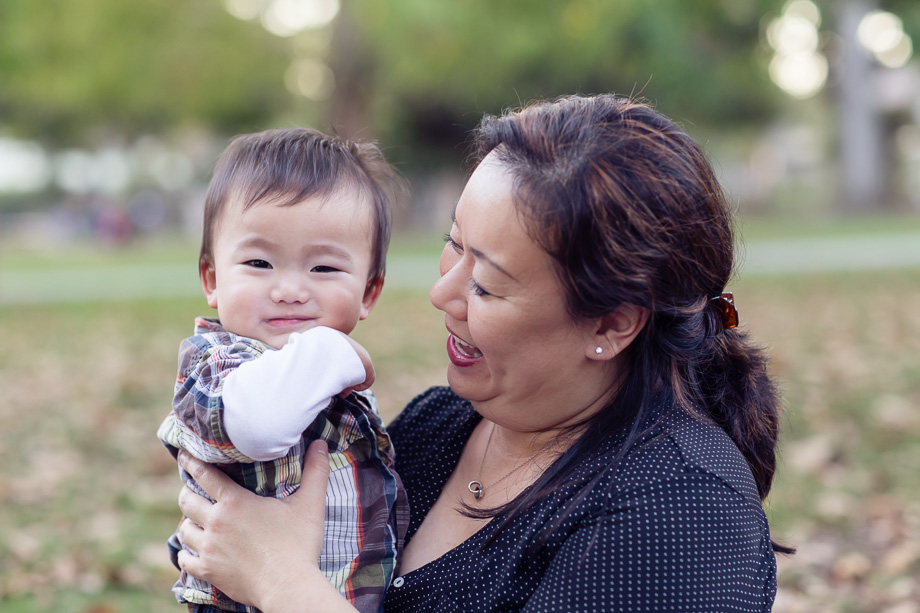 Adorable 15 month old chubby faced toddler with Mom