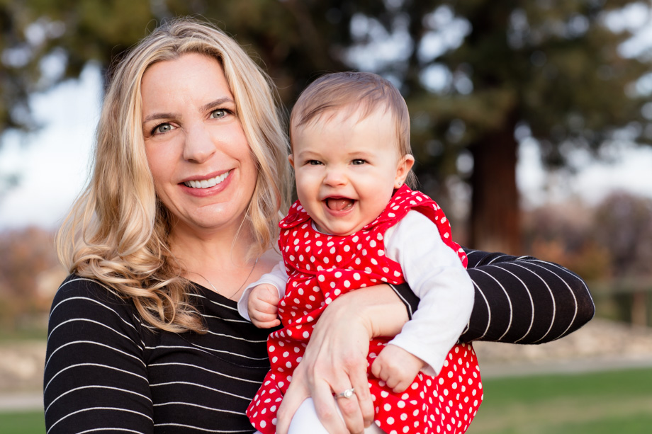 Xmas family photo - happy baby girl with her beautiful mom