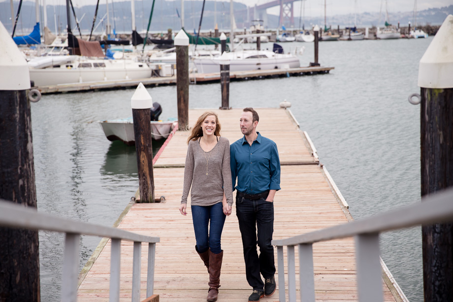couple walking along a pier in Sausalito