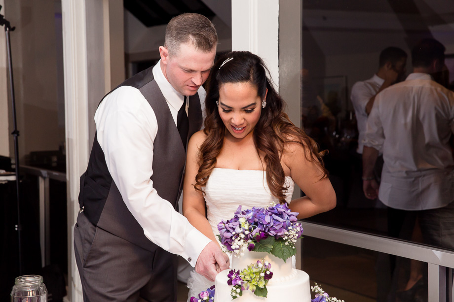 Bride and groom cutting the cake together at Boundary Oak Golf Club