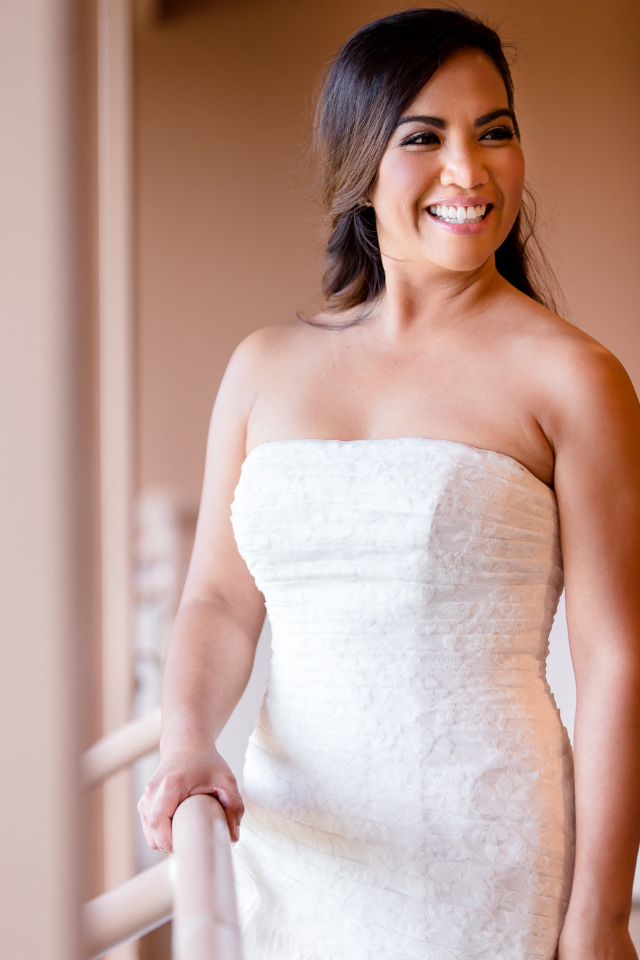 Stuning bridal portrait under gorgeous lighting, natural makeup and beautiful hair down do in a strapless lace wedding gown