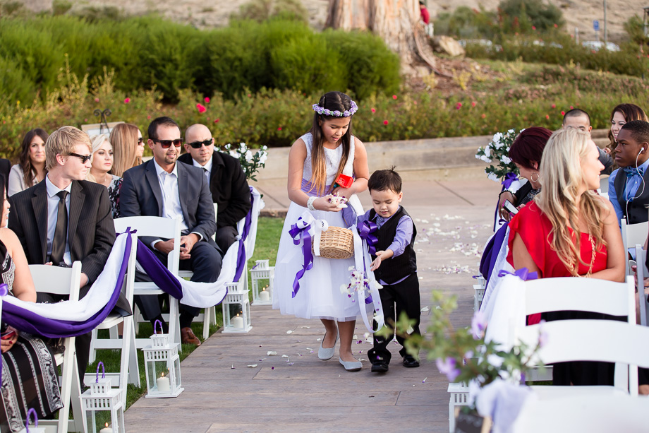 Flower girl and flower boy speading the flower petals before the brides entrance