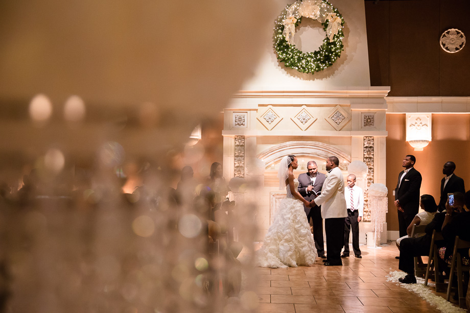 Couple exchanging vows in the ceremony room at Casa Real