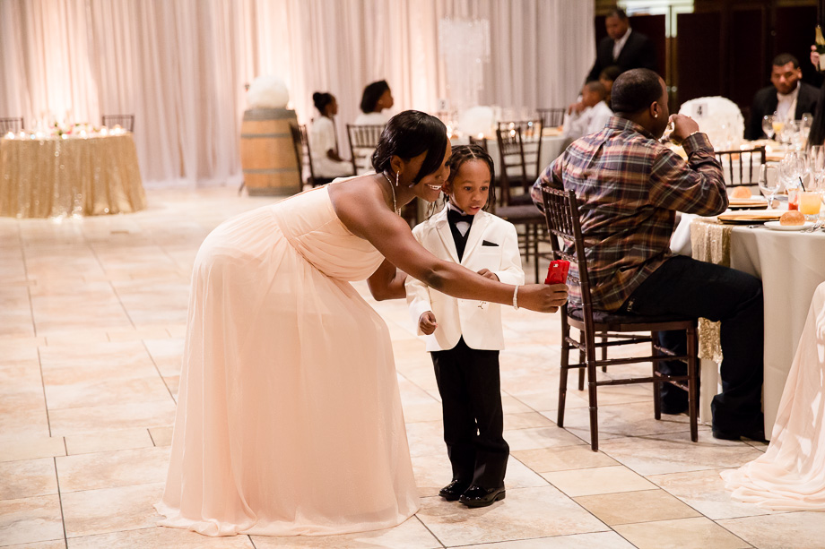 Bridesmaid and ring bearer taking a selfie together