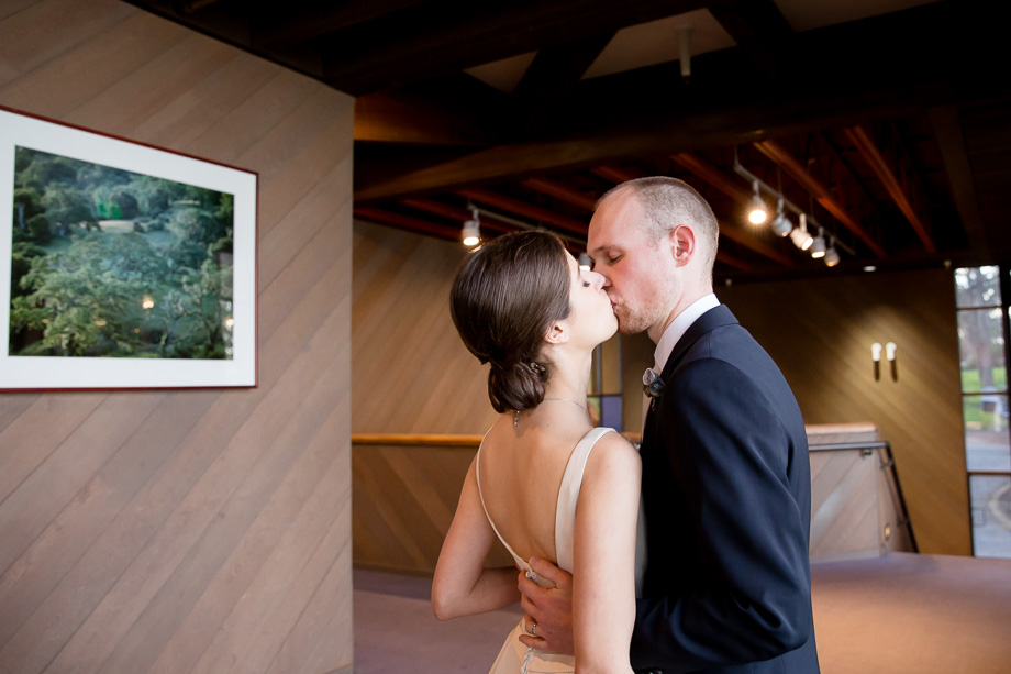 bride and groom sharing a kiss right after their ceremony