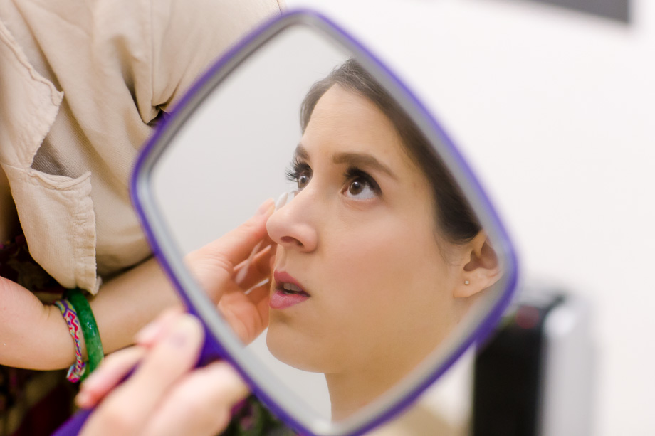 Bride is having her makeup touched up