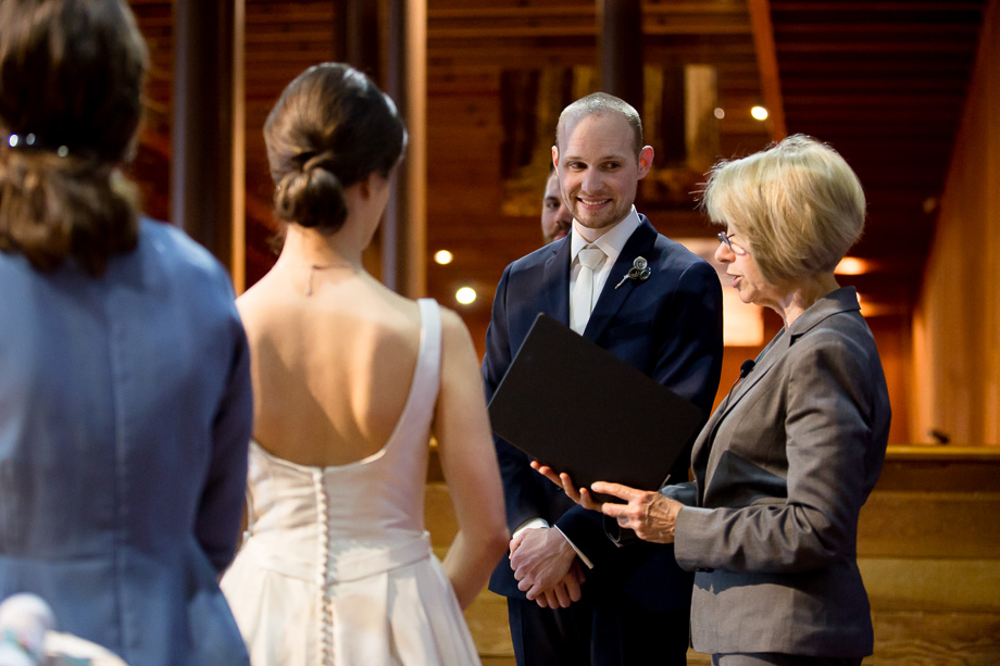 happy groom at the indoor ceremony