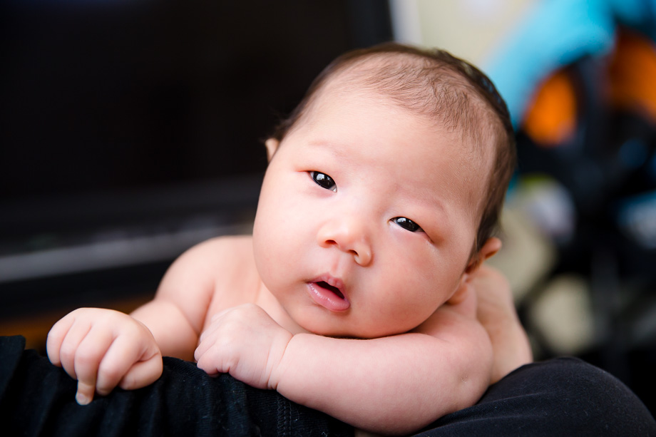 One month old baby girl eyes wide open