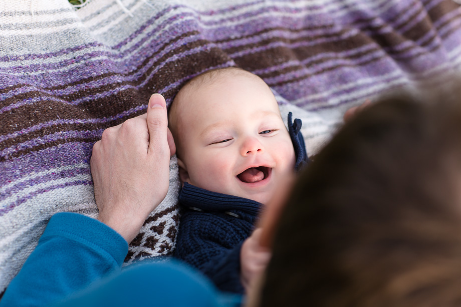 6 month old infant smiling to daddys voice