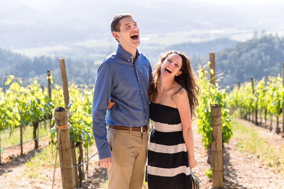 newly engaged couple laughing from the bottom of their hearts at viader