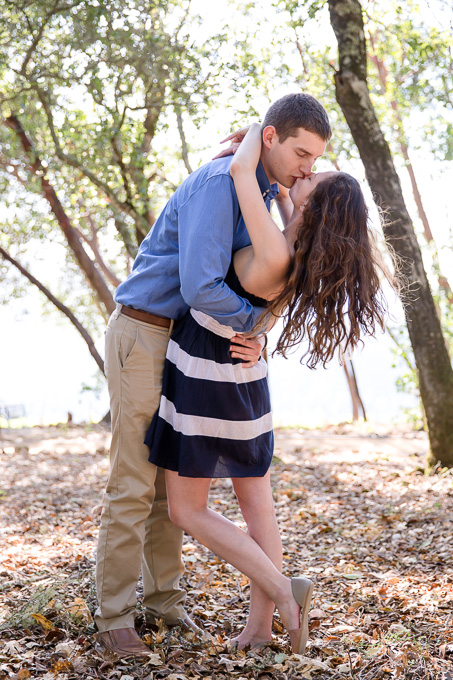 a romantic kiss between the newly engaged couple