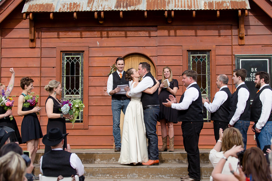 newlyweds sharing their first kiss