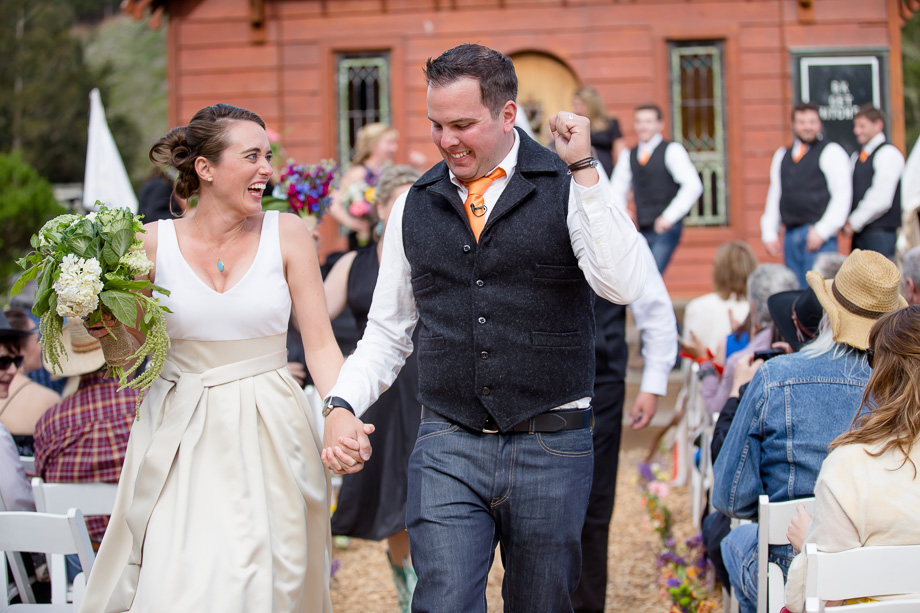 newlyweds dancing down the aisle