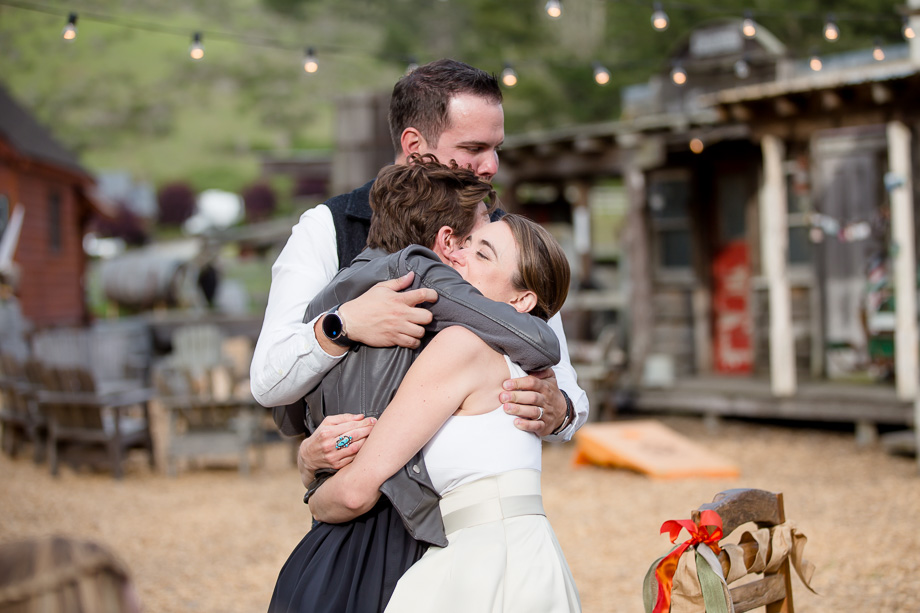 a warm hug from the bride and groom