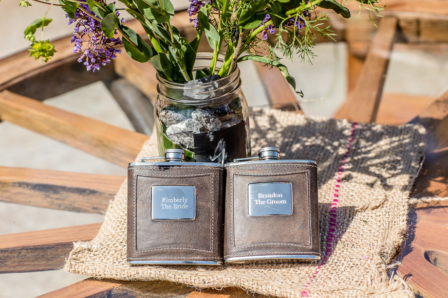 Bride and grooms flasks at the sweetheart table
