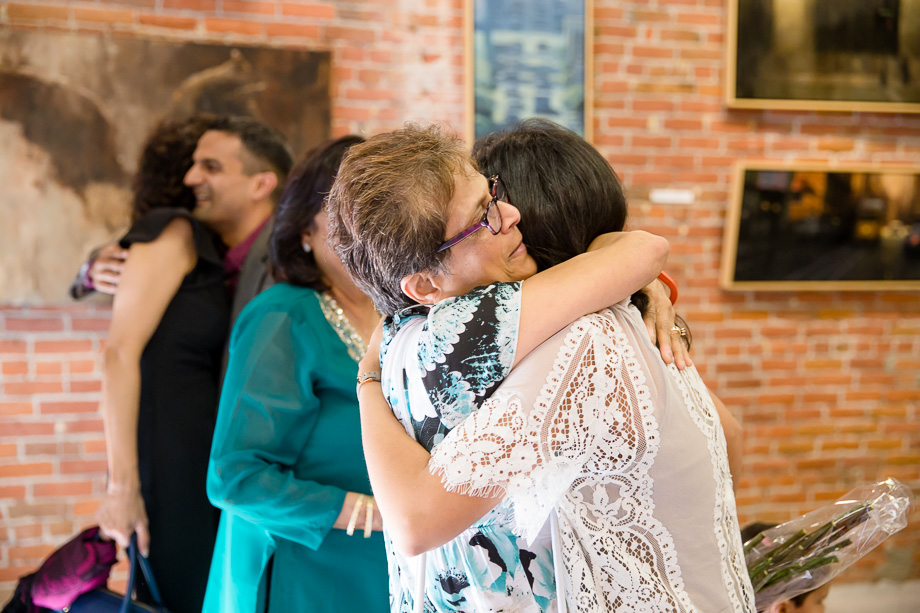 a warm hug with the family after the proposal