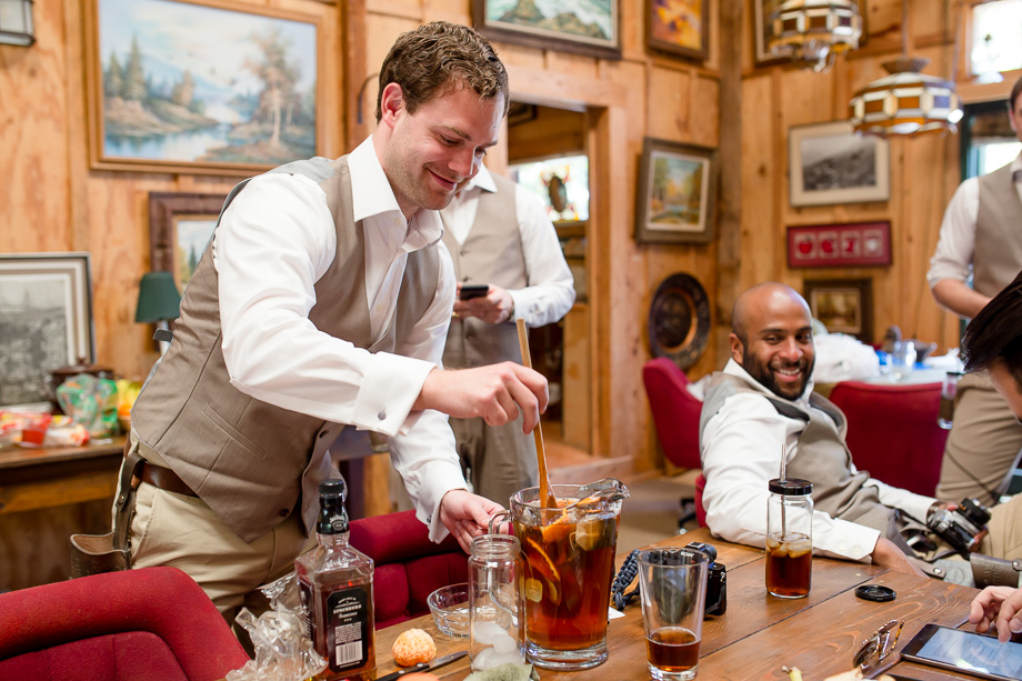 groomsmen making sangria before the ceremony