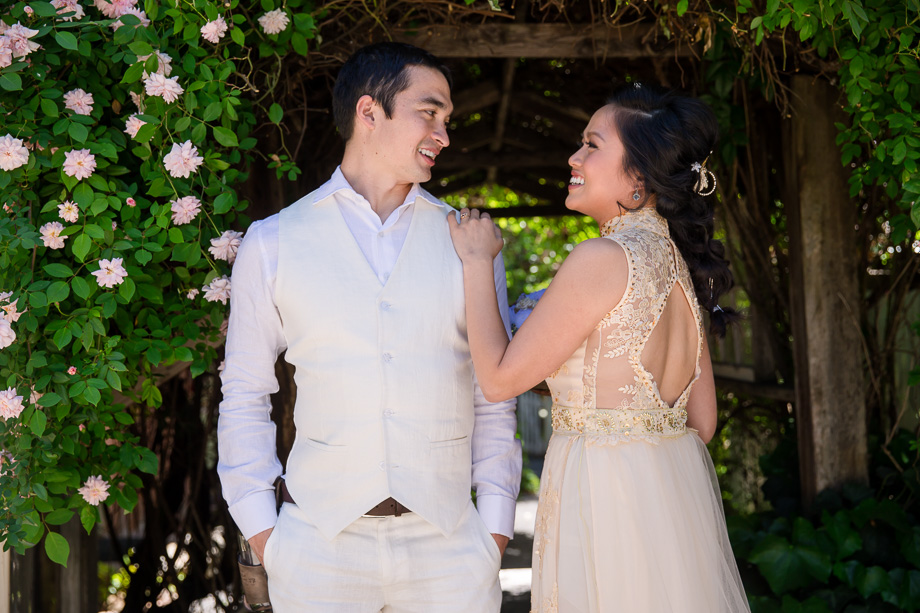 couple under the flower tunnel